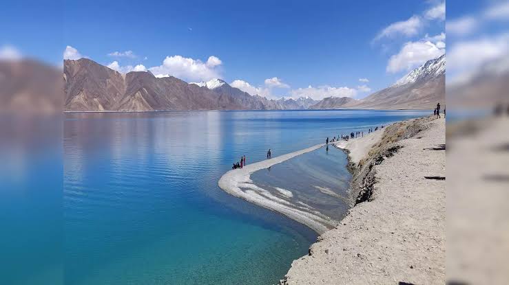 A beautiful lake and sky is clear some white cloud are present in the sky Winter Tourism in India