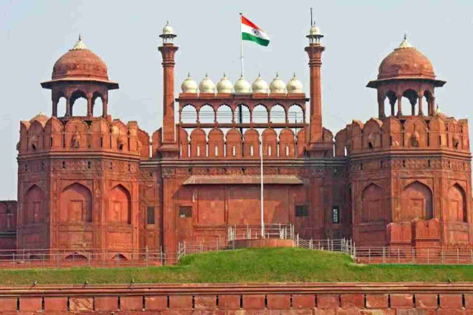 Red fort walls has red brick and an Indian flag on the top