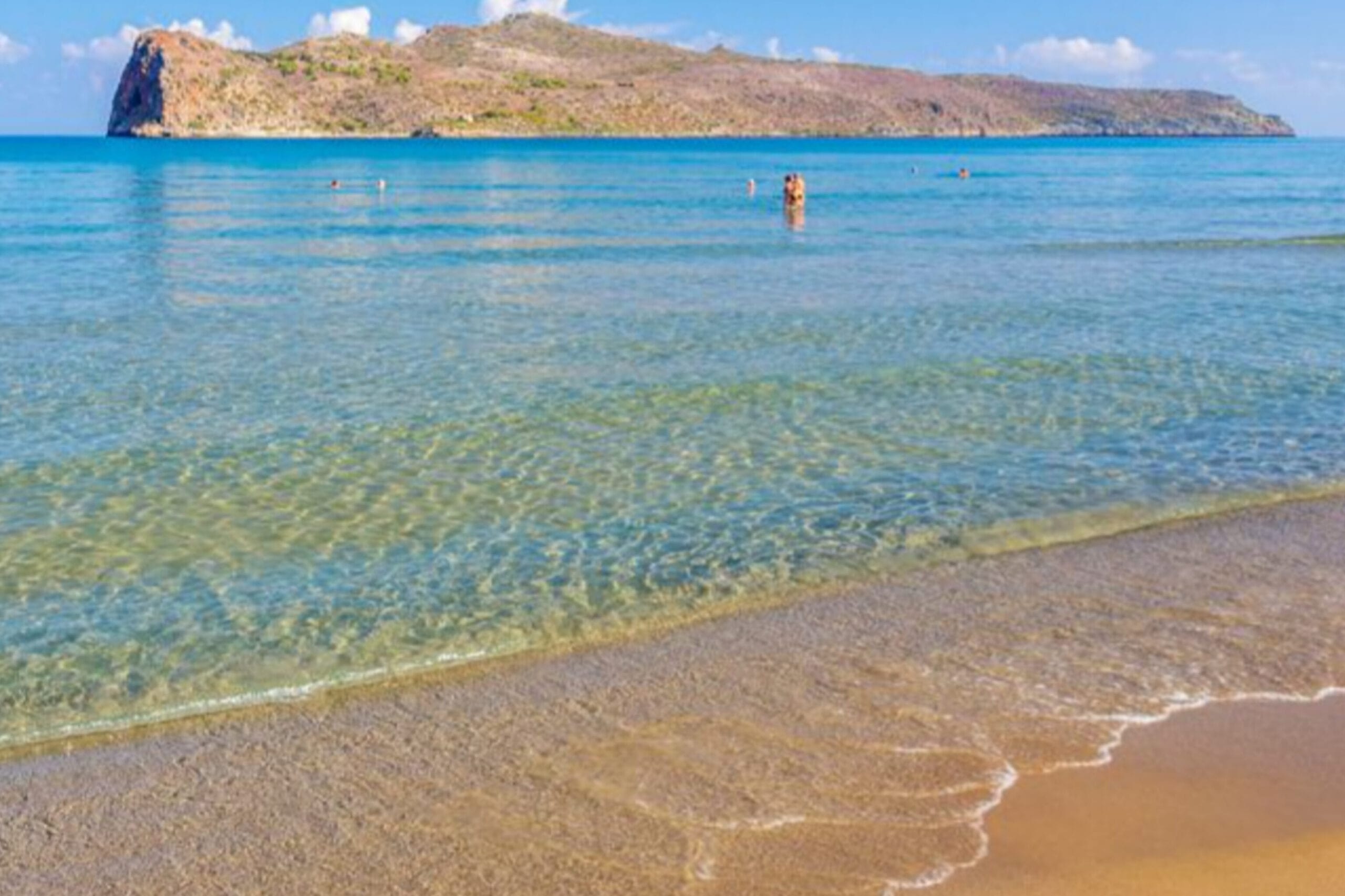 Sea water is transparent and sand present on side of the sea