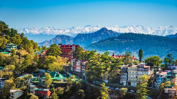 greenry all over the mountain and there are some Houses across the hills Winter Destinations In India