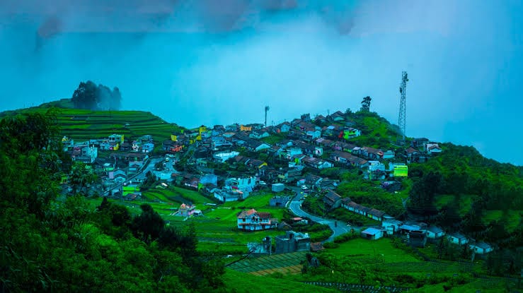 Kodaikanal's greenery visible across the eye sight and clouds are seems like smoke