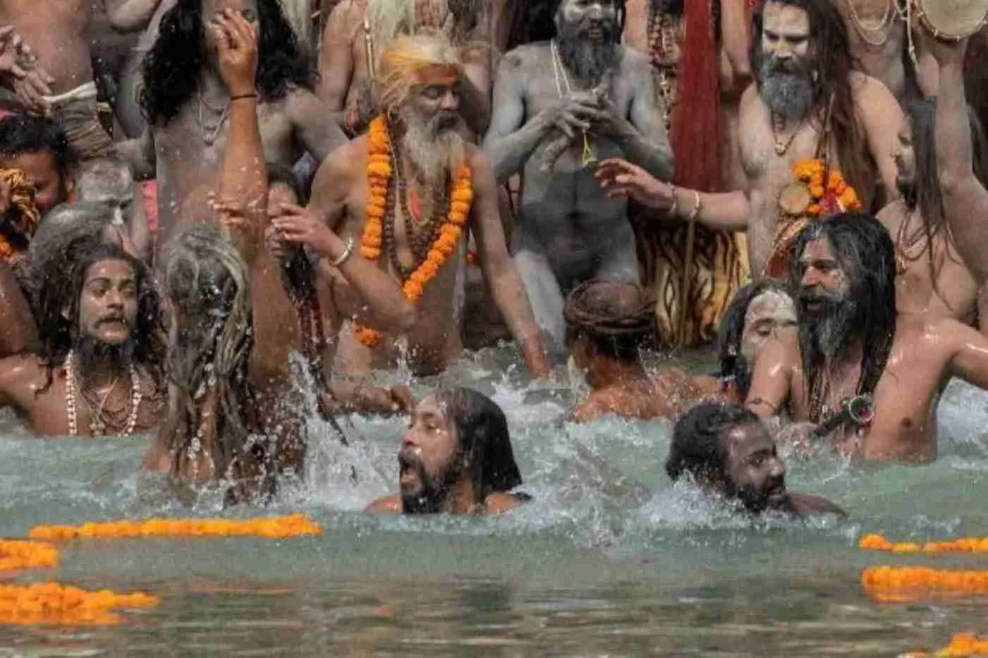 Naga Sadhus are bathing in the river in कुंभ मेला