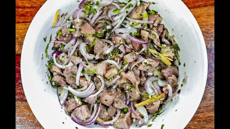 Pork bharta kept in white plate in त्रिपुरा के 10 पारंपरिक व्यंजन